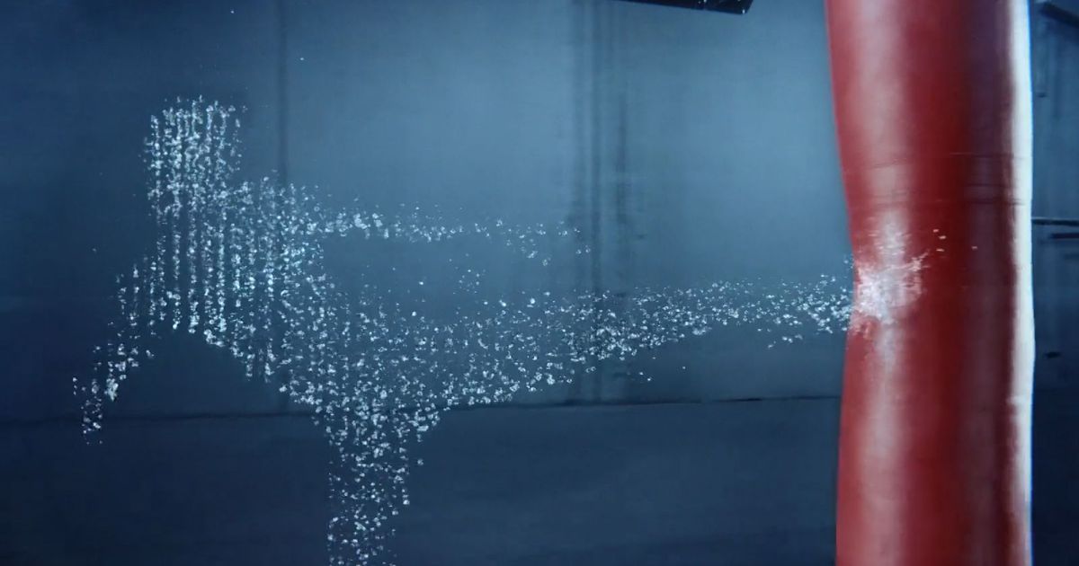 water-droplets-were-animated-in-midair-to-create-a-life-sized-human-figure-for-an-ad